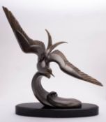 *After Irénée Rochard (1906-1984), a patinated and parcel gilt metal model of a tern in flight,