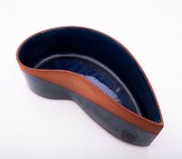 Eden Pottery terracotta bowl of crescent shaped form partially glazed in blue green and yellow,