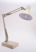 An 'Anglepoise' style adjustable metal and plastic desk lamp,
