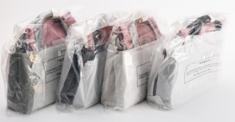 Radley. a group of four small grab bags