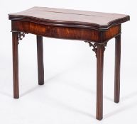 A George III mahogany serpentine front c