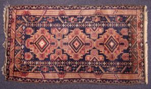 A Kuba rug, the shaded field with triple