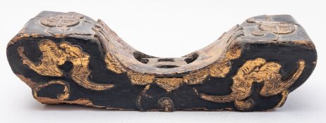 A Chinese carved wooden pillow picked ou