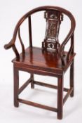 A Chinese stained wood elbow chair, late