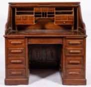 A mahogany roll top twin pedestal desk,