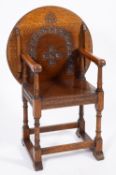 An oak 'monk's chair' in 17th century ta