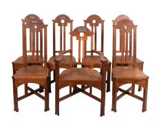 A set of seven oak chairs in Arts and Cr
