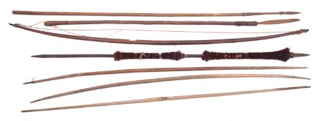 A group of four various tribal bows, to