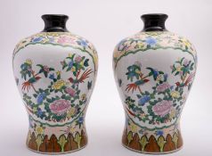 An Oriental porcelain floor standing vas