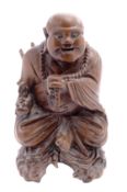 A Chinese carved hardwood figure of Buda
