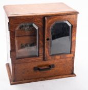 An Edwardian oak and glazed humidor, ha
