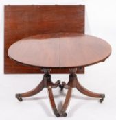A Regency mahogany dining table,