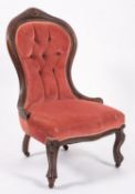 A Victorian carved walnut and button uph