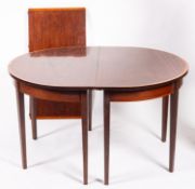 A mahogany and crossbanded dining table