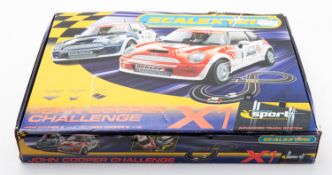 A Scalextric John Cooper Challenge plays