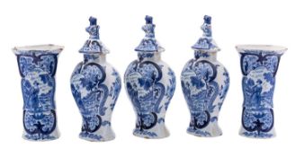 A Dutch blue and white delftware five-piece garniture of vases comprising three baluster vases and