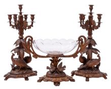 A 'Black Forest' carved and stained linden wood table garniture, probably Brienz, Switzerland,