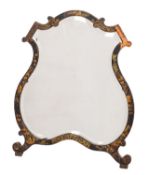 A black lacquer and chinoiserie easel frame dressing mirror of cartouche outline,