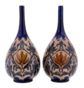 A pair of large Doulton Lambeth stoneware bottle vases by Frank A.