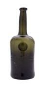 A sealed cylinder wine bottle of olive colour with rounded shoulders, raised neck and applied rim,