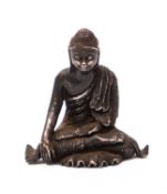 An East Asian silver miniature figure of Buddha seated in meditation, 5.5cm.