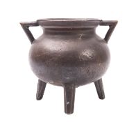 A bronze cauldron,