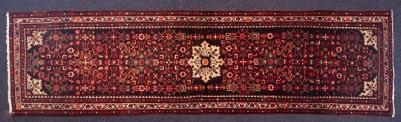 A Malayer runner, the shaded field with all over geometric designs,