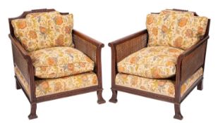 An Edwardian mahogany three piece Bergere suite,