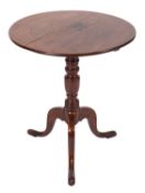 An early 19th Century oak circular occasional table,