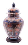 A large French octagonal baluster vase and cover in the Japanese Imari style,