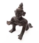 An Indian bronze figure of Krishna modelled as the Butter Thief, 19th/20th century,