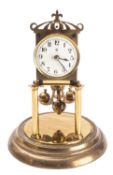 An early 20th century 400-day mantel clock the movement having a galleried top and stamped to the