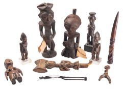 A group of African carved wooden figures,