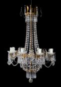 A gilt metal and glass hung eight light chandelier, in Regency taste,