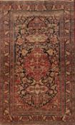 An Ispahan rug, the indigo cartouche field with a central crimson cartouche pendant medallion,