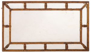 A Gilt gesso rectangular marginal wall mirror in the Regency taste,