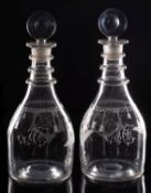 A pair of Masonic clear glass decanters of oviform with triple neck rings the flanks engraved with