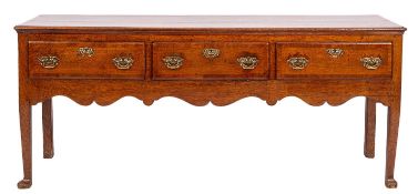 An 18th Century oak and crossbanded dresser base, the top with a moulded edge,