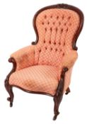 A Gentleman's Victorian carved walnut armchair,