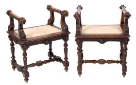 A pair of late Victorian carved stained beechwood window seats in the Carolean taste,