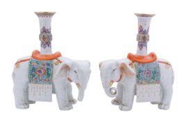 A pair of Chinese famille rose elephant candlesticks in Canton style,