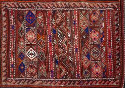 A Balouchistan Bag, the stiped field with bands of hexagons, lozenges and zig zags, 85cm x 62cm,