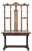 A late 19th Century oak hallstand with Admiral Fitzroy's barometer fitted to the back,