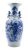 A large Chinese celadon-ground baluster vase, late Qing dynasty with dragon handles,