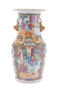 A Chinese Canton famille rose vase, late Qing dynasty the neck applied with lion dogs and chilong,