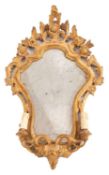A Continental carved giltwood girandole wall mirror, of cartouche shaped outline,