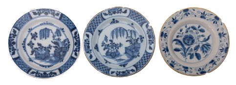A pair of English blue and white delftware plates and a similar Dutch plate,