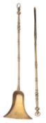 A pair of brass fire tools,