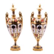 A pair of large Royal Crown Derby 'Imari' pedestal urns, 20th century decorated in pattern 1128,