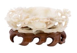 A Chinese carved and reticulated jade brush washer/pouring cup,